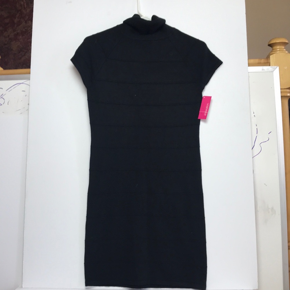 Black turtle neck unworn dress. Tags are intact.
